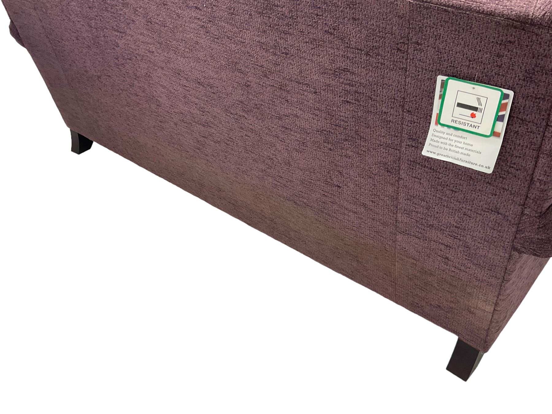 Parker Knoll - pair of large two-seat sofas upholstered in purple fabric, turned mahogany finish front feet with brass cups and castors 