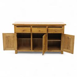 Contemporary solid oak sideboard, rectangular plank top above three drawers and three panelled cupboard doors, fitted with wooden knop handles