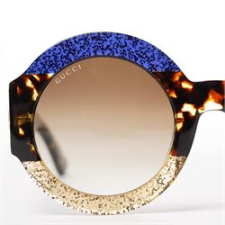 Gucci - pair of oversized round sunglasses, with gradient tinted lenses in a tortoiseshell-effect frame with blue and gold glitter inlay, the temples with interlocking gold-tone GG logo and bee motif, unused with original cloth and hard cases