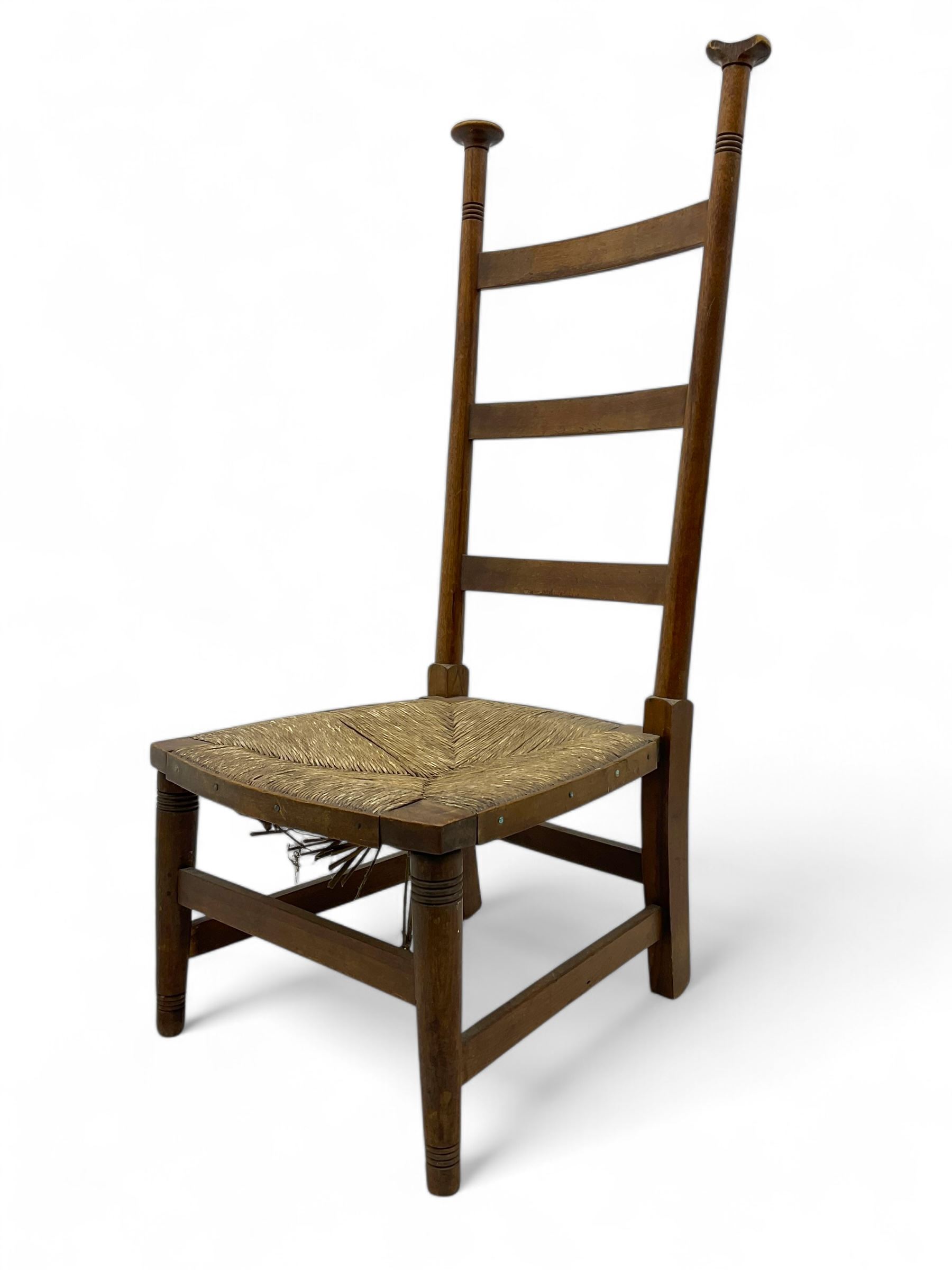 Attributed to William Birch of High Wycombe - Arts & Crafts oak ladder-back side chair, with turned finials, rush seat, and stretchers, raised on square-section supports; 19th century mahogany Pembroke table, rectangular drop-leaf top raised on turned supports with central stretcher and splayed feet
