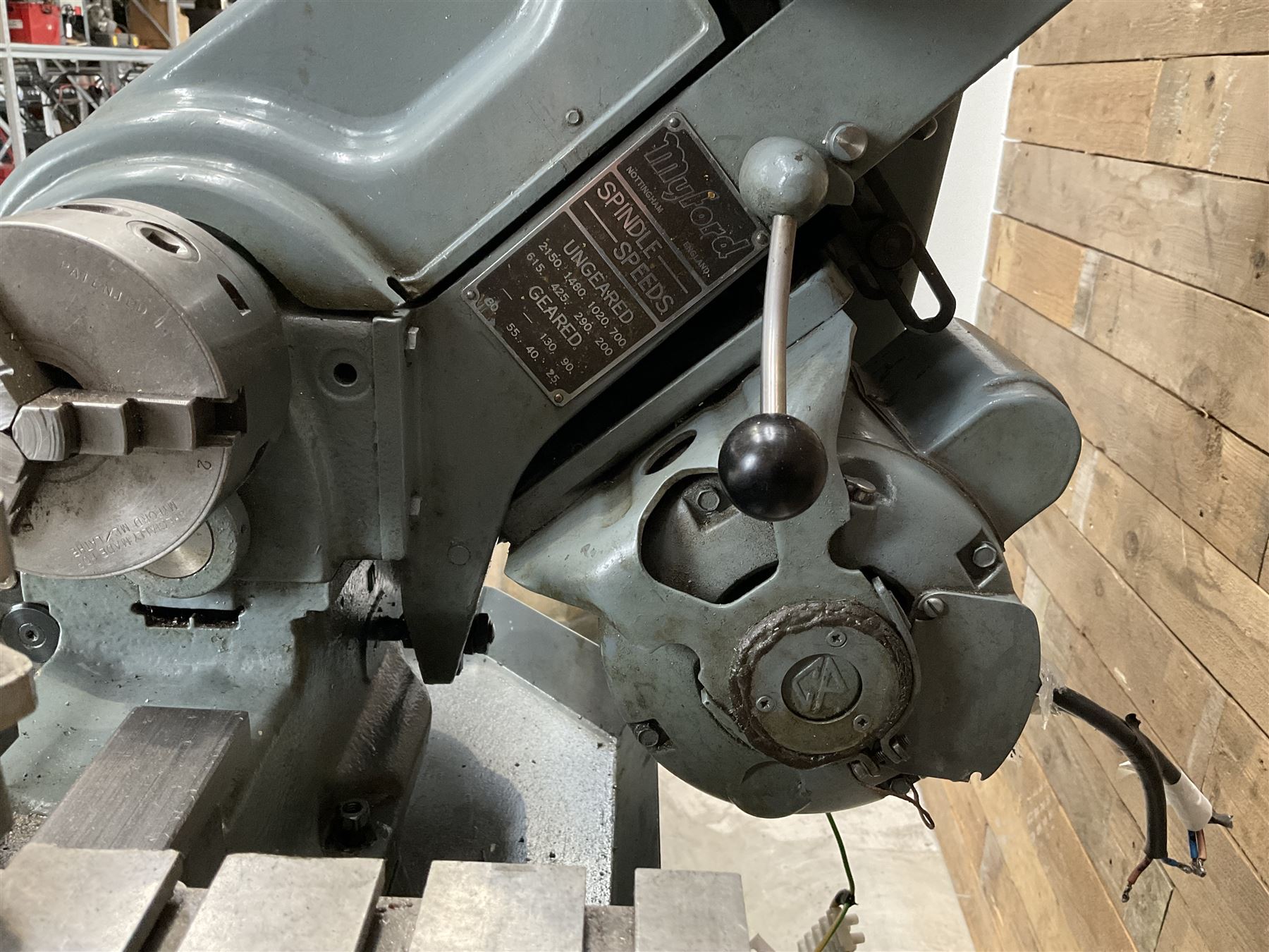 Myford Super 7 metal turning lathe with extensive collection of attachments, chucks, collets, bits; and precision metal saw