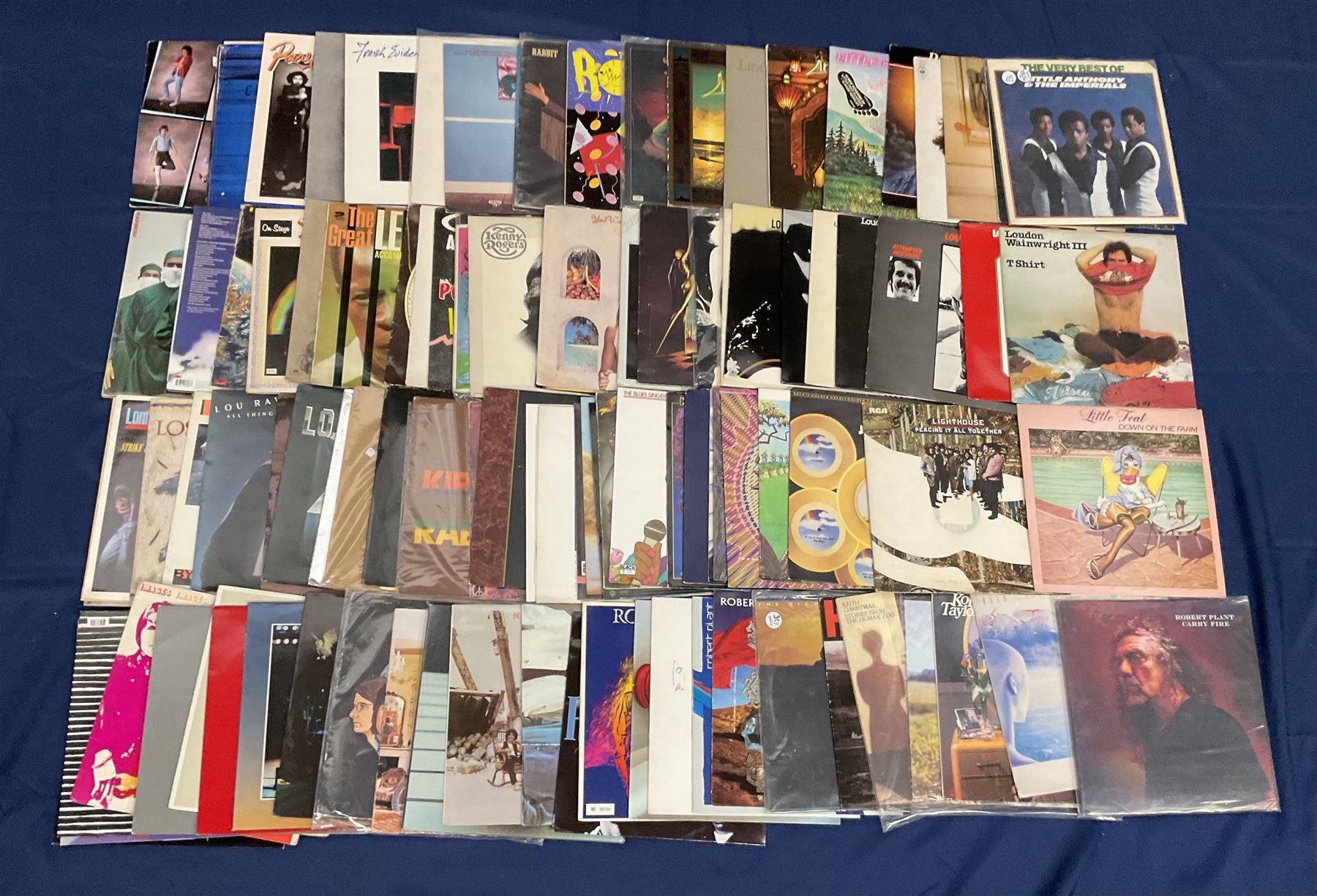 Quantity of vinyl records including Rag 'n' Bone Man 'Human', Richie Blackmore's 'Rainbow', Lighthouse 'Thoughts of movin' on', Rush 'All The World's A Stage', Rose Tattoo 'Assault & Battery', Little Feat 'Dixie Chicken', 'Shake Me Up', 'Time Loves A Hero', 'The Last Record Album' and other music, approximately 100, in one box