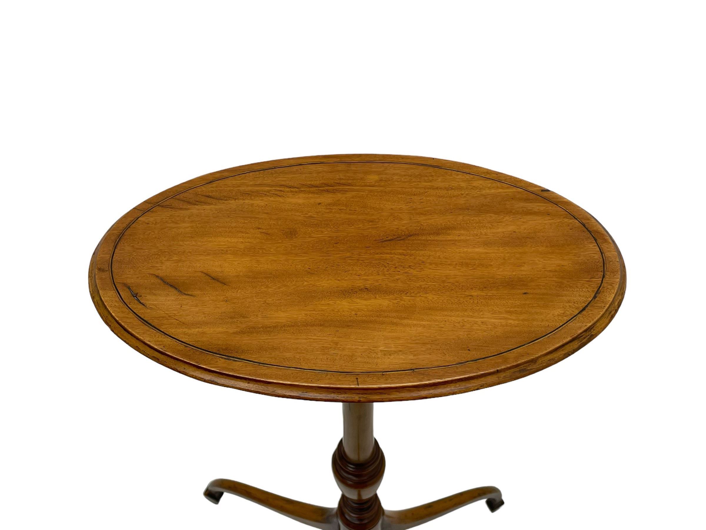 19th century satinwood tripod wine table, moulded oval top inlaid with boxwood and ebony stringing, fine turned vasiform column, three splayed supports with spade feet