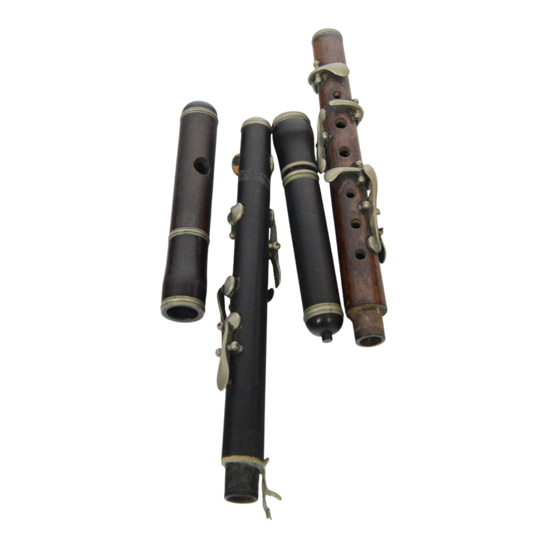 Pair of 20th century continental tin glazed tiles, of a man and a woman in traditional dress, H15cm, together with a Baby Cine Camera in case, flute parts, and Continental oil on board