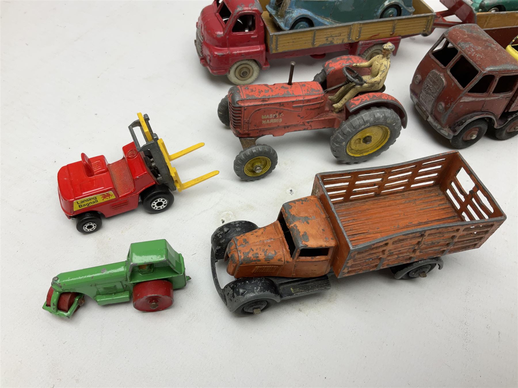 Dinky - sixteen unboxed and playworn die-cast models including Foden lorry, Big Bedford lorry with Halesowen Farm Trailer, Thunderbolt land speed record car, Spirit of the Wind racing car, market garden truck, Bedford tipper, station wagon, tanker, motorcycle combination etc; two Corgi models; and five Matchbox/Lesney models (23)
