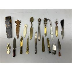 Collection of page markers,to include three trowel shaped examples, carved wooden marker with foliate detail, mother of pearl example etc