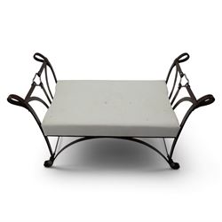 And So To Bed - 'Handel' wrought iron window seat, the rectangular upholstered seat enclosed by scrolling and arched ends with shaped uprights, on scrolling supports united by curved stretchers