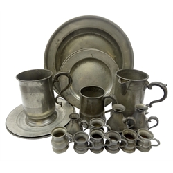  Georgian pewter single reeded circular dish, rim stamped DIM, D34cm, four later circular dishes, D23.5cm, two quart, one pint and one 1/4 gill stamped measures, four other measures and three Irish pewter Haystack measures (16)  