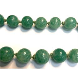 Chinese jade bead necklace with silver open work clasp with a cabochon greenstone/possibly jade bead necklace, signed Liu with Chinese character marks