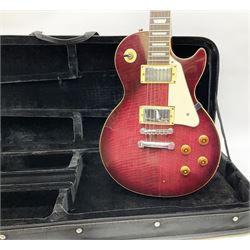 1980s Les Paul Epiphone limited edition cut-away electric guitar by Gibson, the burgundy coloured body with two pick-ups, volume and tone knobs and scratch plate, original tuning pegs, serial no.U6030215, 101cm overall; in modern Kinsman fitted carrying case
