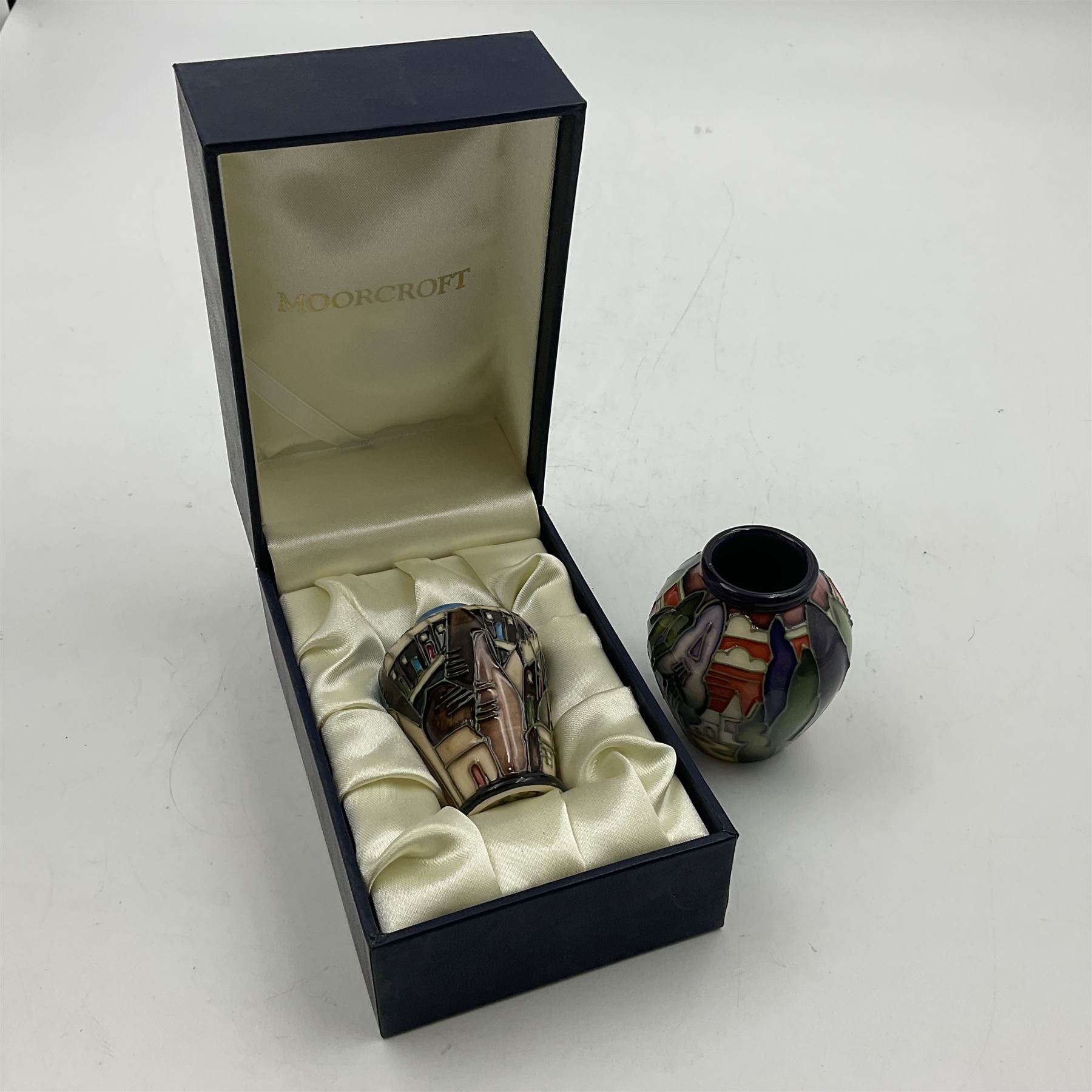 Two miniature Moorcroft vases, one decorated in the Lodge Hill pattern, circa 2007, H6cm,  and the other decorated in Made in Burslem circa 2011, H6cm  