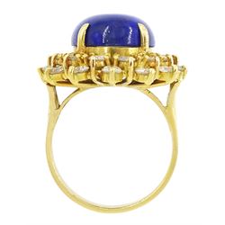 18ct gold lapis lazuli and diamond cluster ring, single oval cut lapis lazuli with two rows of round brilliant cut diamonds, stamped 750, total diamond weight approx 1.70 carat