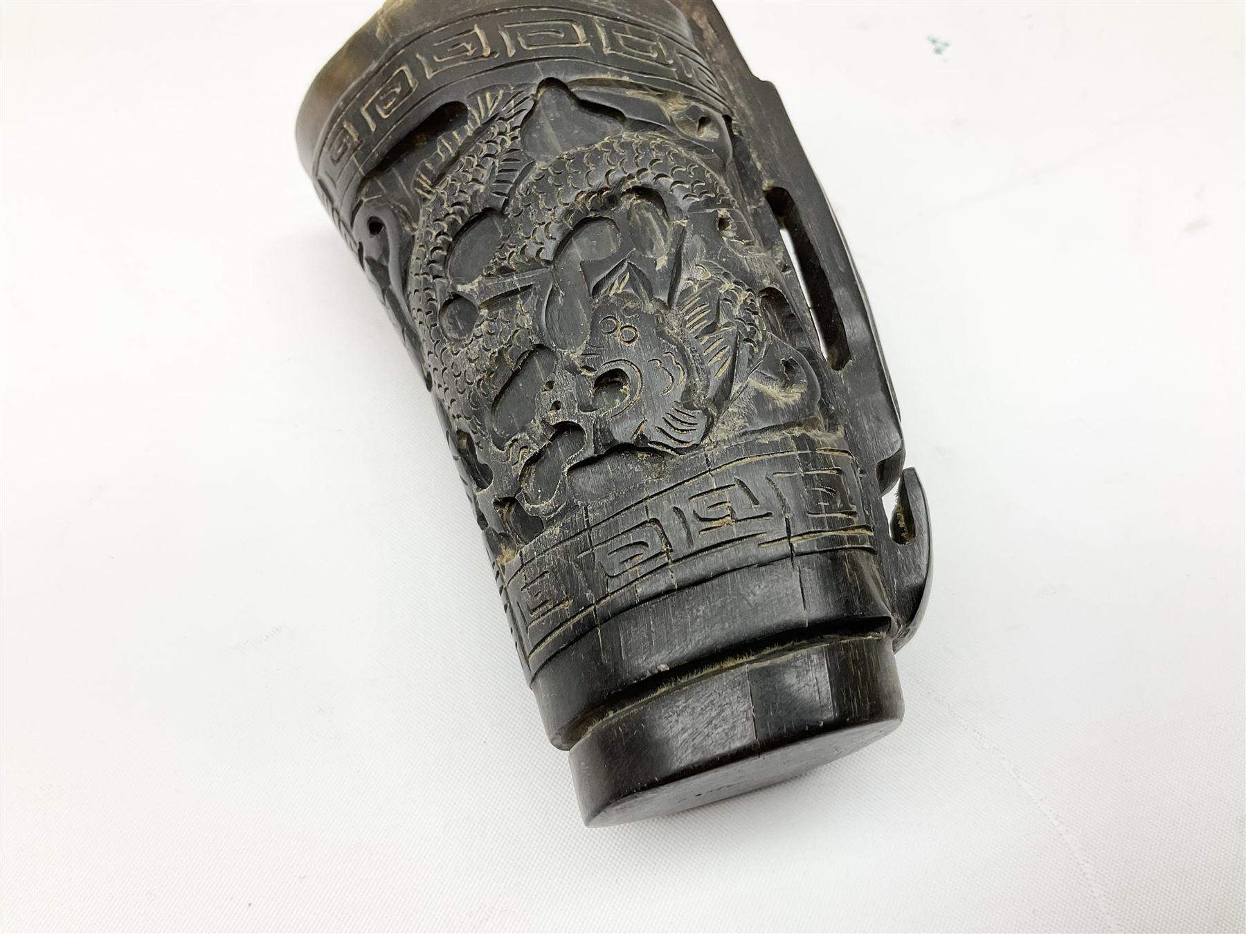 Chinese horn blood collection cup, carved with dragons and key fret border, H9.5cm