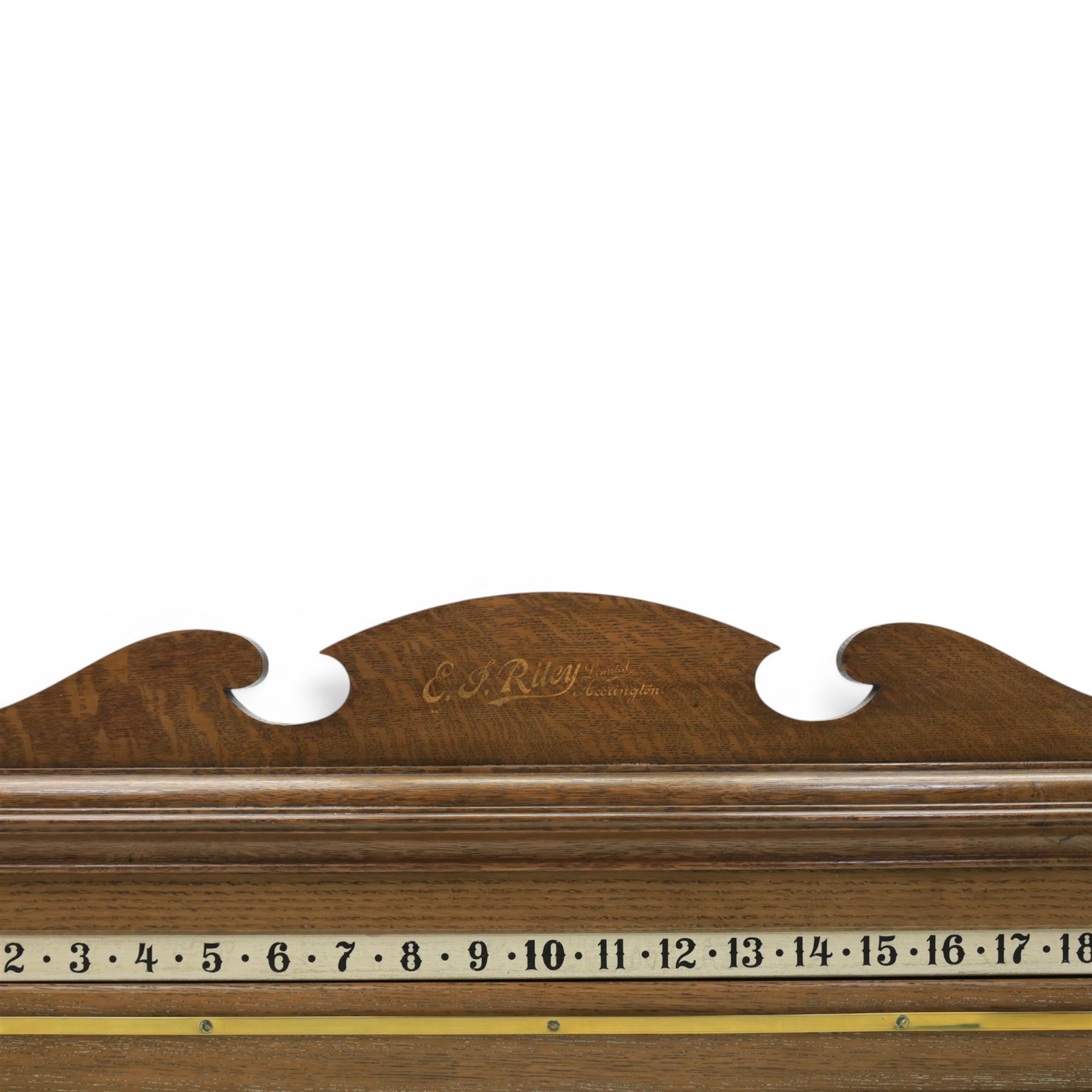 E.J. Riley - 20th century oak billiards scorer, with broken arch pediment with gilt markers mark, with revoling scorer with turned knob, brass indicator, with brass wall hangers