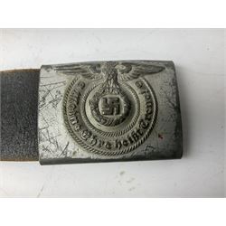 WW2 German 'SS' leather belt with six pouches (one containing unused field bandage) and buckle inscribed 'Meine Ehre Heifst Treue'; belt marked 0/0836 0029
