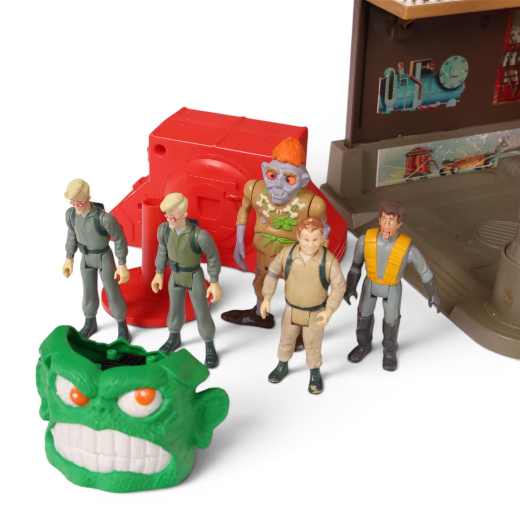 1980s Kenner The Real Ghostbusters toys, including Firehouse Headquarters playset and figures, Stay Puft Marshmallow Man and Slimer, Brain Blaster Ghost and Ghostzapper