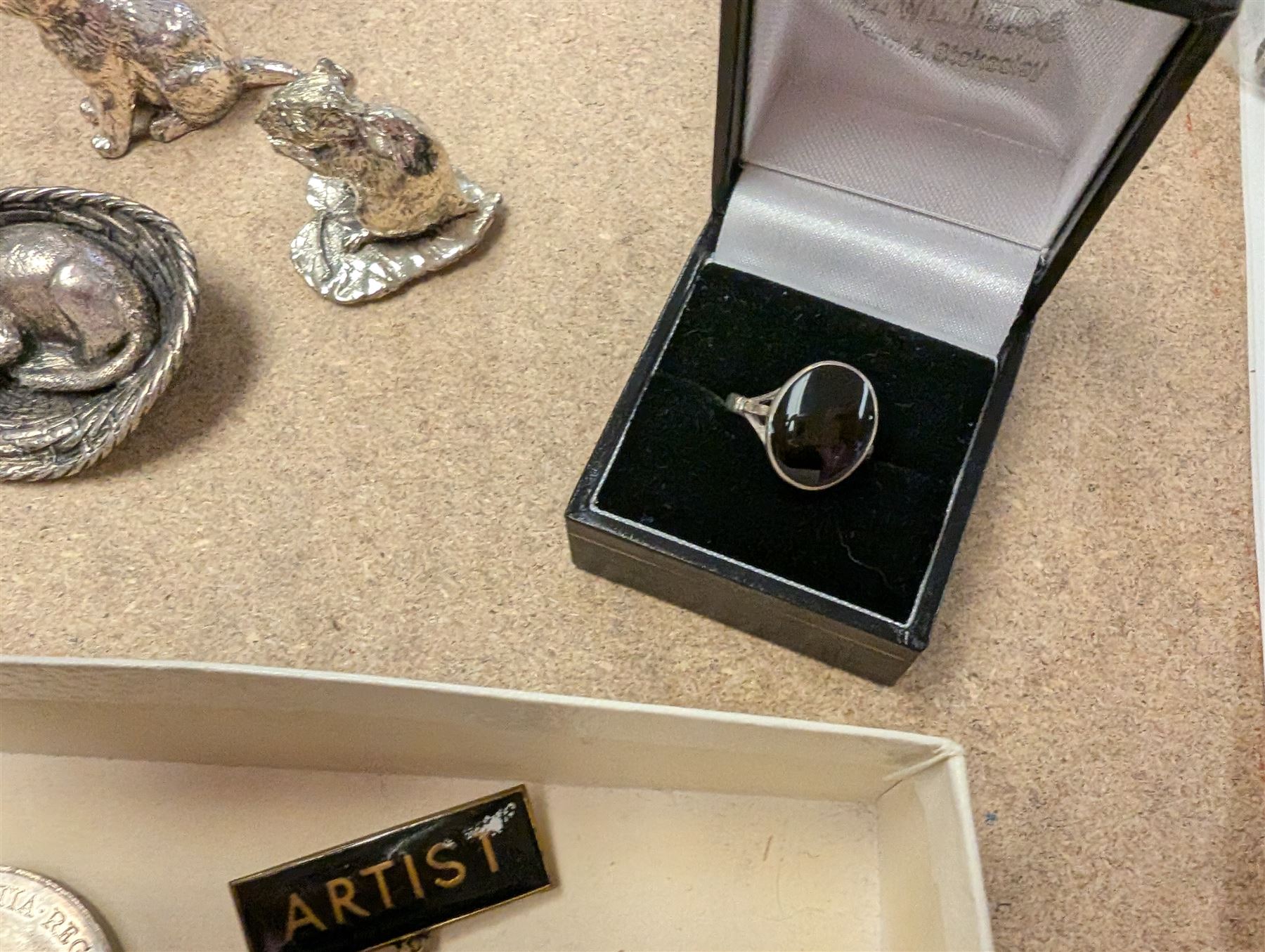 Pair of silver knife rests, two silver handled butter knives and a silver handled button hook, all hallmarked, together with a silver onyx pendant and ring, white metal figures and coins etc 