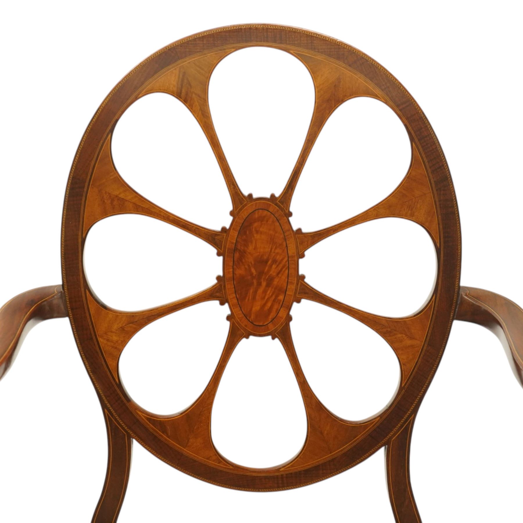 Hampton & Sons (Pall Mall 1830-1957) - Pair of Edwardian inlaid mahogany wheel-back elbow chairs, the pierced oval backs with chequered stringing and cross banding, out-swept arms over canework seats, banded seat rail over square tapering supports with spade feet, stamped to underside
Provenance: Kirkham Hall