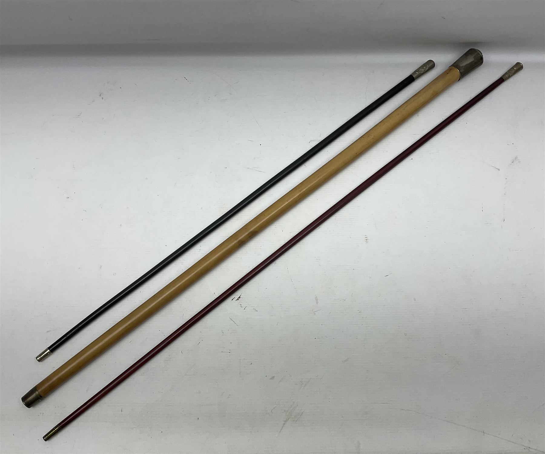 Three parade ground canes - malacca cane Coldstream Guards with plated mount engraved 'H.A. Myhan' L87cm; ebonised Church Lads Brigade 'Fight The Good Fight'; and mahogany stained Worcestershire Regiment (3)
