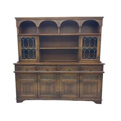Old Charm oak wall display cabinet, fitted with two lead glazed doors above four drawers and four cupboards