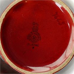 Royal Doulton flambe vase decorated with a rural landscape H17cm, another 'Veined' H11cm and another 'Woodcut' H11cm (3)