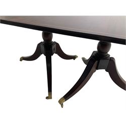 Acorn Industries - Regency design extending twin pillar dining table, with additional leaf, rectangular top with satinwood stringing, raised on turned vasiform pedestal with splayed tripod base and brass castors, carved acorn signature to column, by Alan Grainger of Brandsby