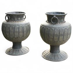 Pair of large Indian cast metal garden urns, each of bulbous form with engraved foliate an...