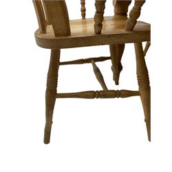 Pine farmhouse dining table, rectangular top with rounded corners, raised on turned supports; together with a set of six (4+2) spindle-back dining chairs