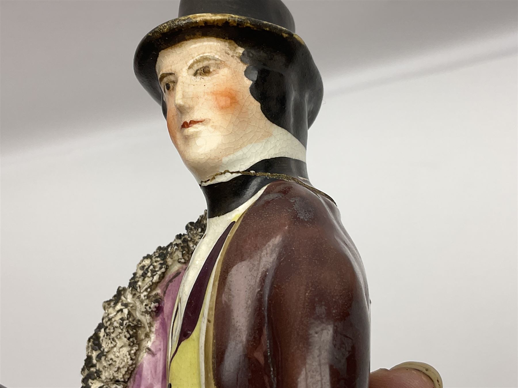 19th century Staffordshire figure of Robert Peel, titled 'Sir Robert Peel', modelled on horseback, atop an oval plinth base featuring a naturalistic and floral design, H30cm 