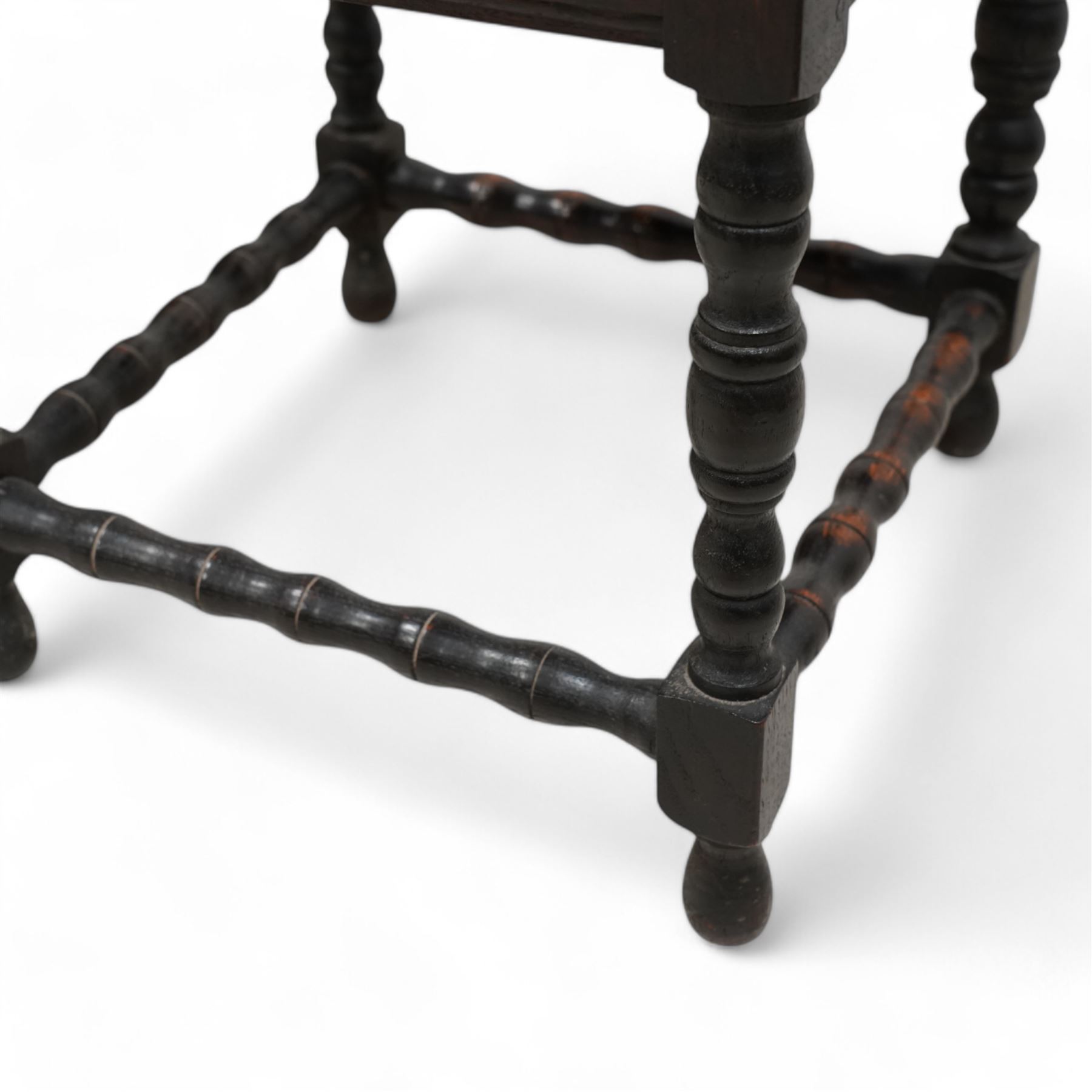 Victorian carved oak corner chair, shaped arms carved with trailing leafy branches, pierced splats over panelled seat, on bobbin turned supports and stretcher