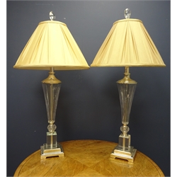  Pair tall cut glass lamp shades with tapered glass stem on chrome square stepped base, with pleated sand coloured shades, H86cm   