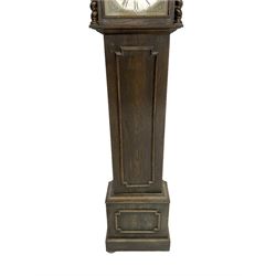 Early 20th century German oak cased 8-day longcase clock, flat topped pediment with a square hood door and attached barley twist pilasters, long trunk door with applied moulding on a conforming plinth with applied skirting, brass dial with spandrels and a matted dial centre, chapter ring with roman numerals and minute track, three train spring driven movement chiming the quarters and hours on 6 gong rods. With pendulum.  