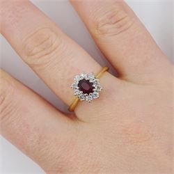 18ct gold oval cut ruby and round brilliant cut diamond cluster ring, London 1976, ruby approx 0.45 carat, total diamond weight approx 0.30 carat