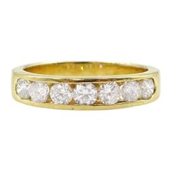 18ct gold channel set seven stone round brilliant cut diamond half eternity ring, stamped 750, total diamond 0.60