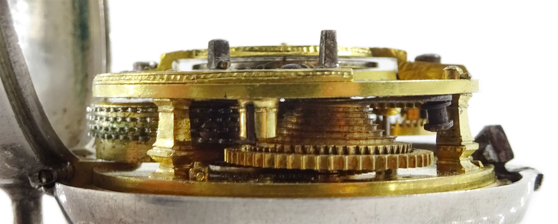 George III silver repousse pair cased verge fusee pocket watch by Samson, London,  No. 20384, square baluster pillars, the enamel polychrome dial depicting a sailor and sweetheart saying farewell, Roman hours and outer Arabic minute ring, inner case by James Richards, London 1793, the outer case depicting figures in an interior setting, with scroll borders interior scene makers mark T.P possibly Thomas Pepper