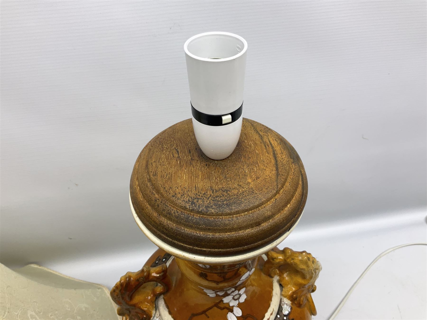 20th century Japanese vase converted to a lamp, the baluster form body decorated with samurai warriors and blossoming branches with twin handles, with wood base and fixtures, with tasselled fabric shade, H56cm excl shade