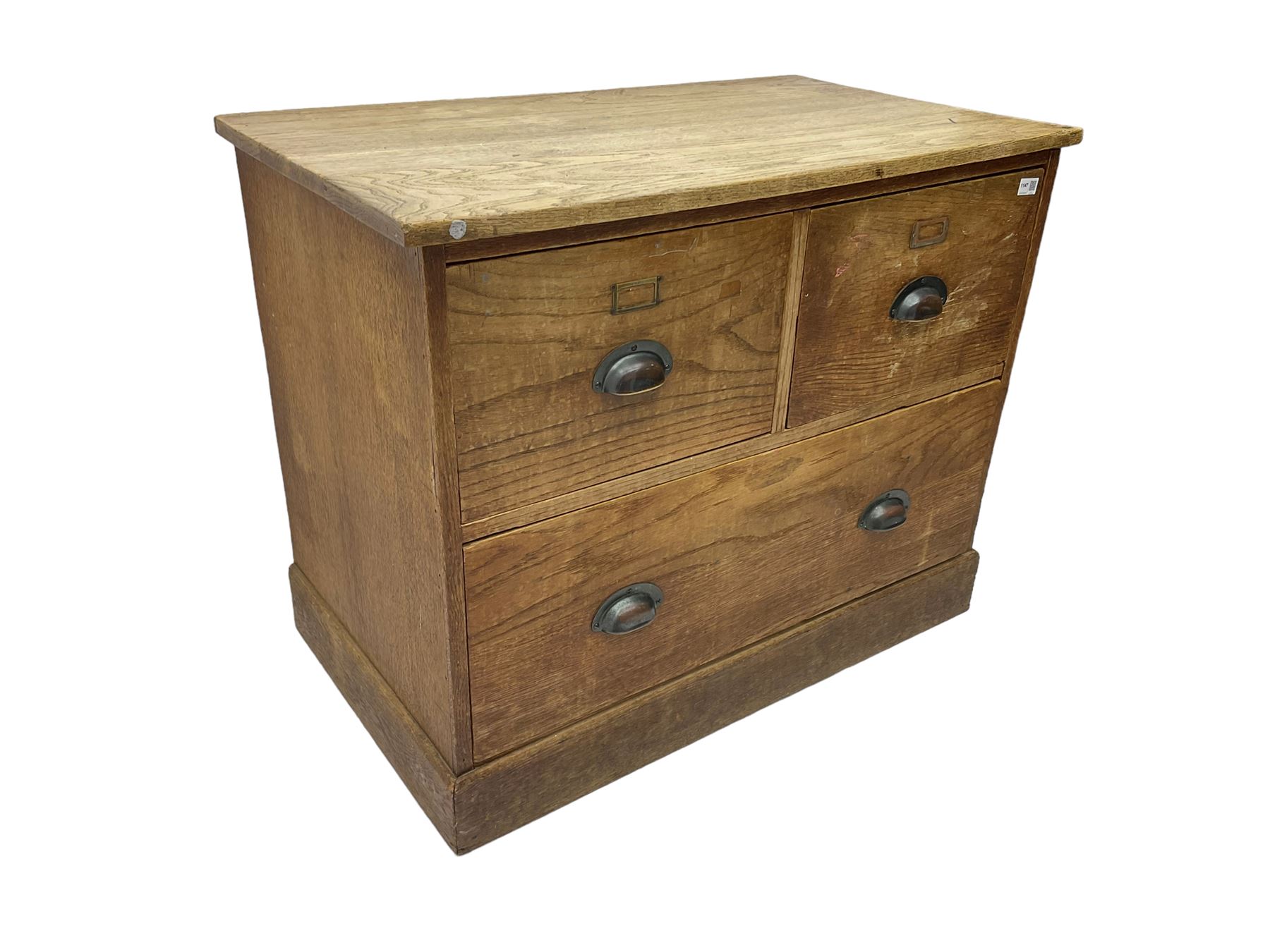 Early to mid-20th century oak chest, fitted with two short drawers over one long drawer, raised on plinth base