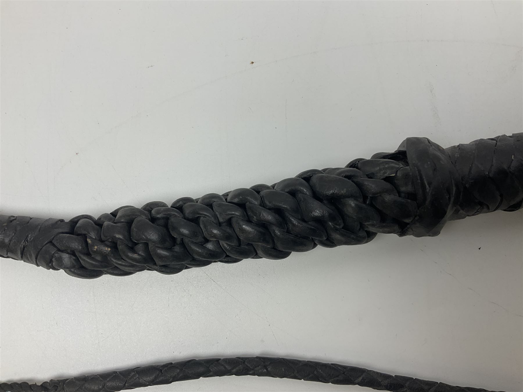 Near pair of short swords each with slightly curving 41cm fullered steel blade and all brass H-shaped hilt L52cm overall; plaited black leather whip; and reproduction pair of brass hilted swords, brass halberd blade and mace (7)