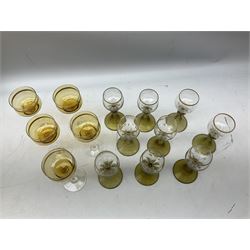 Set of nine German or Dutch Roemer glasses raised on olive coloured tapering spiral stem foot, the bowls with gilt upper rim, H16cm, together with five amber coloured glasses with gilt banding