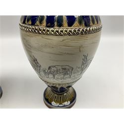 Pair of late 19th century Doulton Lambeth sgraffito vases decorated by Hannah Barlow, each of ovoid form with short neck, upon a circular spreading foot, decorated with a central sgraffito band of deer between foliate detailed borders, with impressed and incised marks beneath including monogram, H17cm