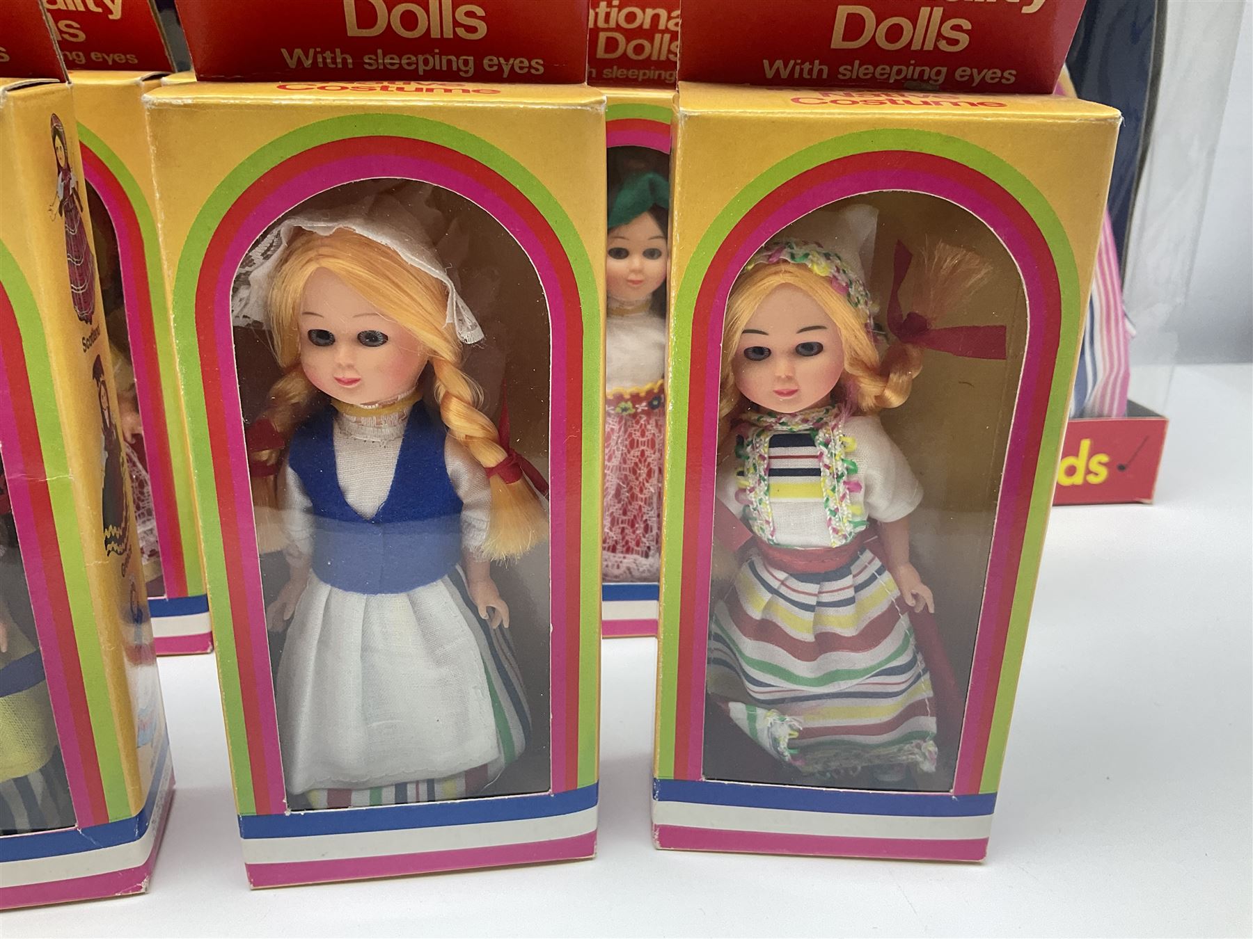 Four Mayfair Products Musical Dolls of Many Lands; original boxes and delivery boxes; and set of twelve Nationality Dolls with Sleeping Eyes; boxed (16)
