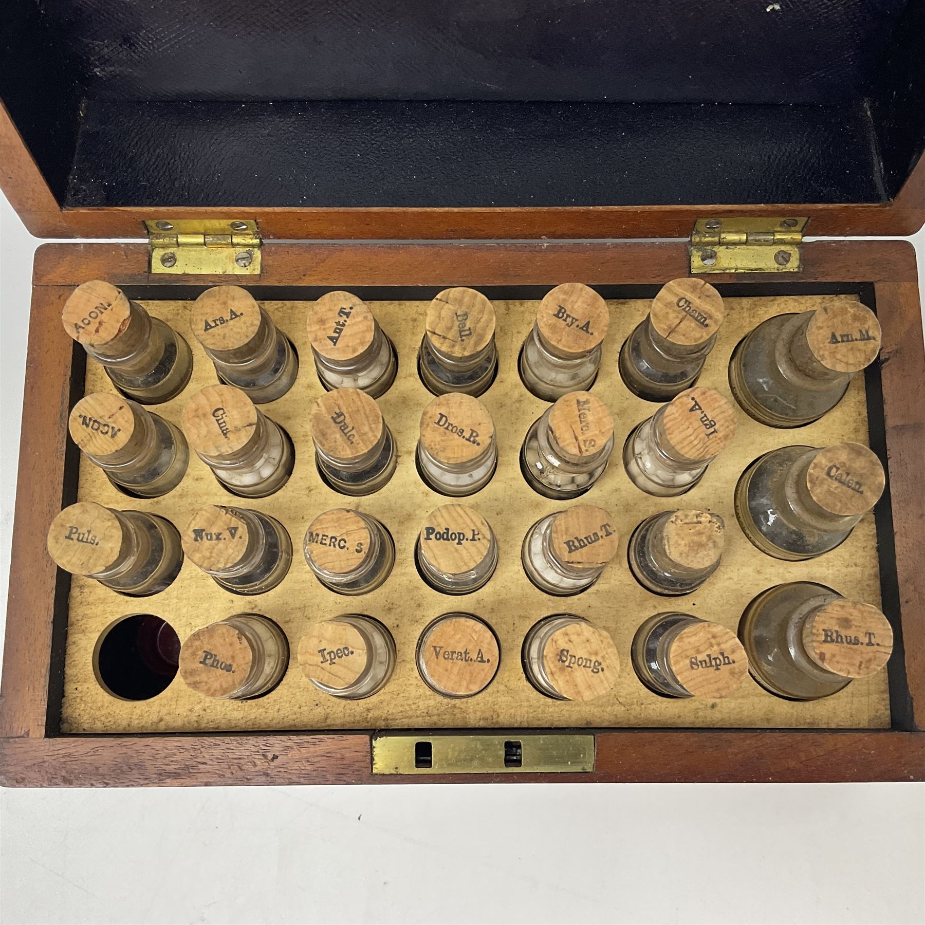 Ashton & Parsons Homeopathic pharmacy box, the fitted interior with thirty glass bottles with cork stoppers and labels to the glass, H10cm, L21cm