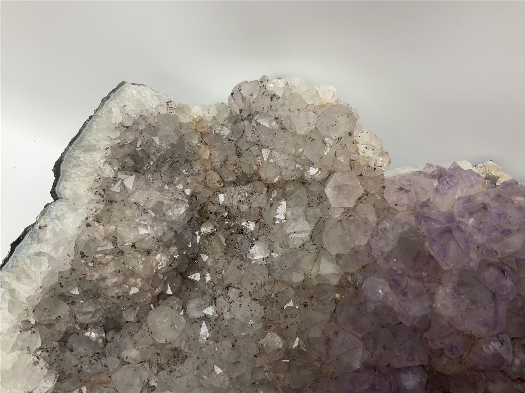 Amethyst crystal geode cluster, with well-defined crystals of various sizes, H13cm, L46cm