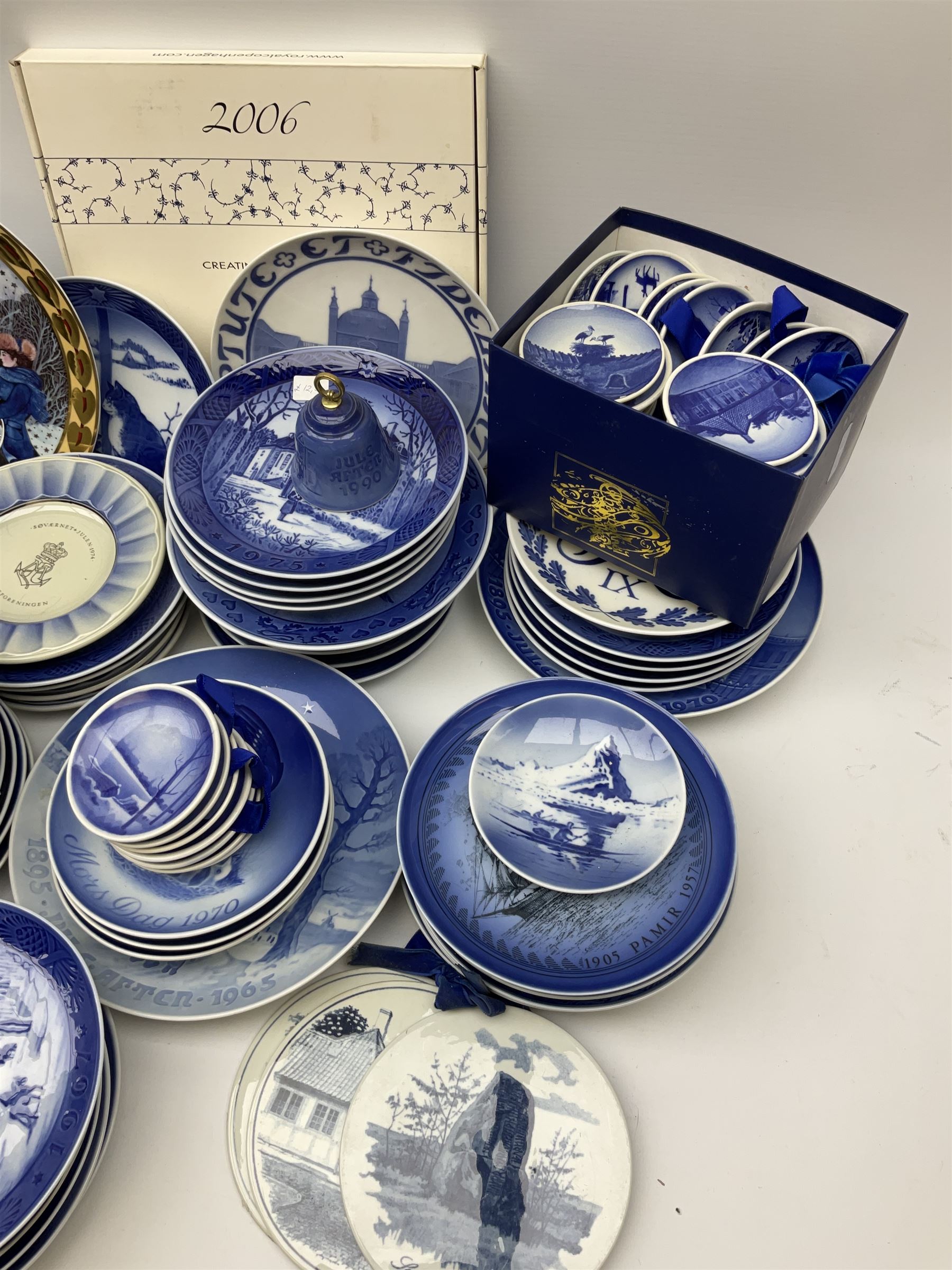 Royal Copenhagen thirty-eight assorted Christmas calendar plates, from 1963 to 1992, a selection of other Royal Copenhagen decorative plates, a collection of Bing and Grondahl plates, ceramic bells, etc. 