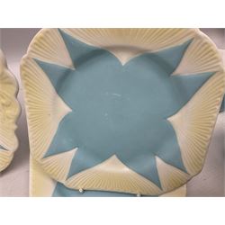 Shelley Dainty pattern tea wares, of lobed form with blue star decoration on merging white and yellow ground, comprising five teacups, five saucers, six tea plates, milk jug and cake plate, all with printed green mark beneath, some with painted pattern no 11770