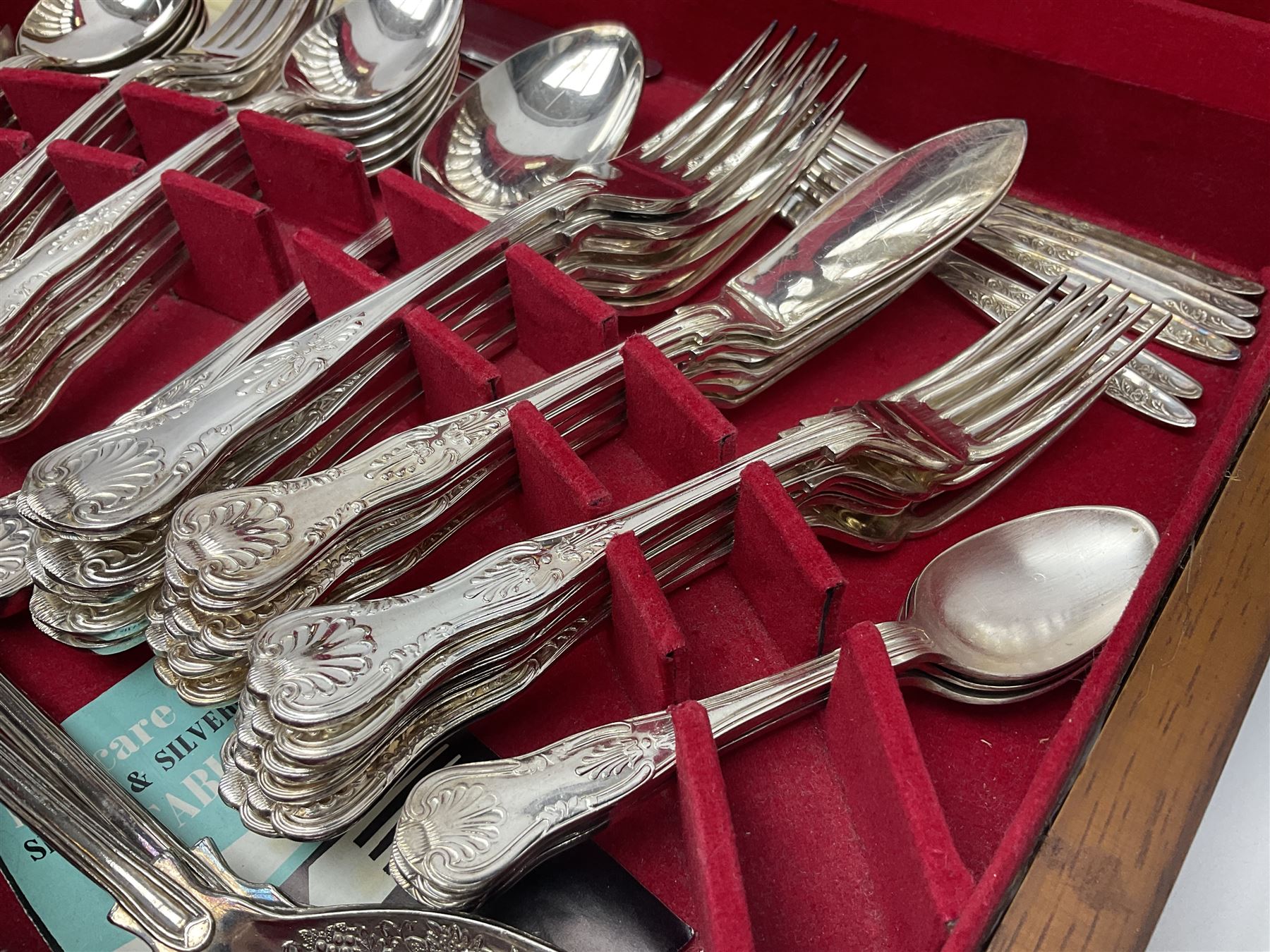 Canteen of King's pattern cutlery for six place settings by James Ryals of Sheffield, with two extra forks, pair of salad servers and six fish knives, all within fitted wooden case, together with six ivorine handled butter knives and six silver plated cake forks