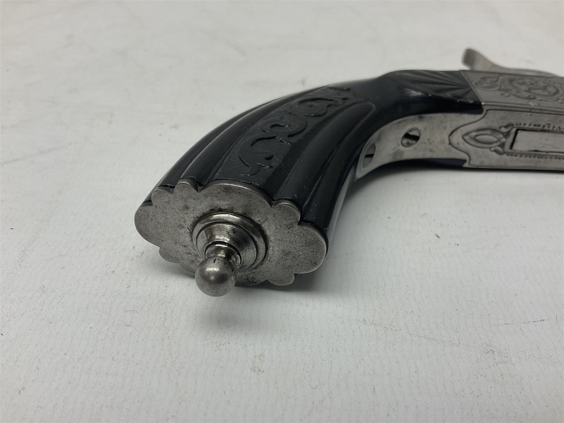 Mid-19th century French Boissy 12mm single barrel pin-fire pistol, the 9.5cm rifled barrel with brown stub twist damascus decoration, side screw under lever opening and English proof marks, retailed by H. Akrill Beverley, chased action with drop-down trigger and carved walnut stock L21cm