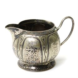 Early 20th century Arts & Crafts fruit dish by Walter Somerfield of the Leicester Art School, H16.5cm; silver plated tea service with trailing floral decoration, and various other hammered pewter items (8)