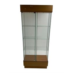 Light oak and glass double display cabinet, glazed back and sides with two divisions, each with three shelves, light fitting to top of each section