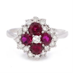18ct white gold ruby and diamond cluster ring, set with round round cut rubies and sevente...